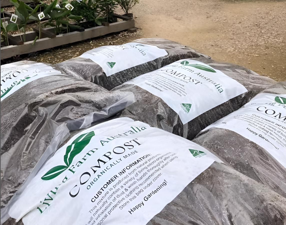 A Bunch of Bags of Compost Are Stacked on Top of Each Other — Black Rock Garden Centre In Tyagarah, NSW