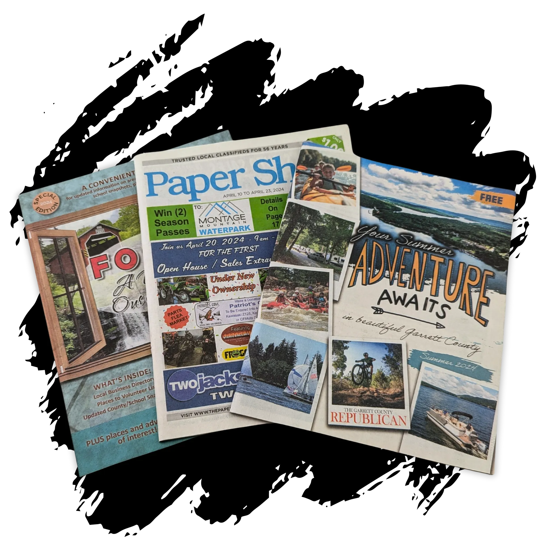 A group of magazines are sitting on top of each other on a table.