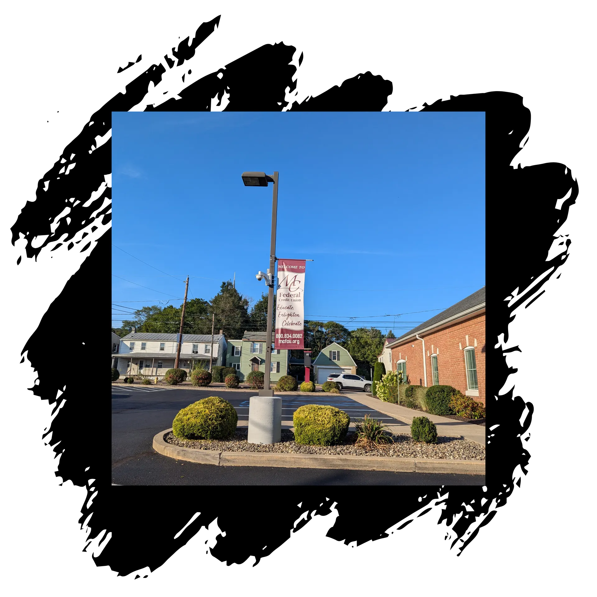 A picture of a parking lot in front of a building