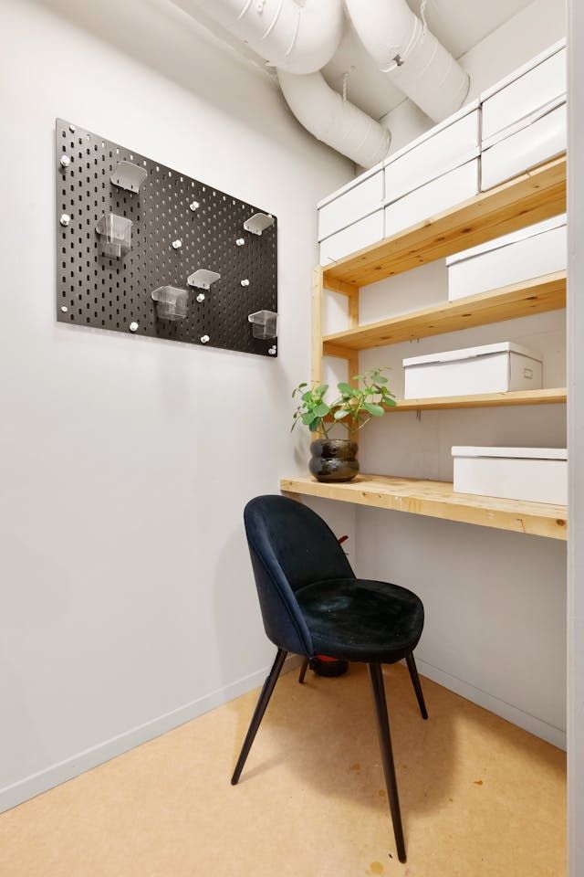 There is a chair and a desk in the room.