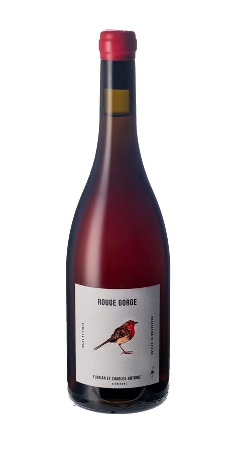 Une bouteille de vin avec un oiseau sur l'étiquette.