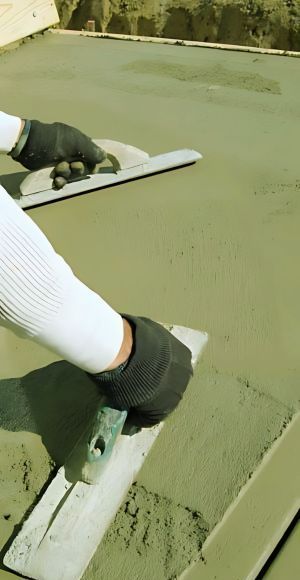 Our concrete team leveling path in extreme weather - adaptable for Hutt Valley's climate.