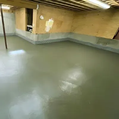 Poured and leveled basement concrete floor for new residential home in Taita.