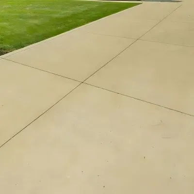 Coloured concrete driveway using the colour ceramic clay, installed and cut in Ebdentown, Upper Hutt.