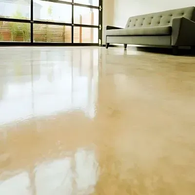 Coloured concrete living area floor polished in Wainuiomata, Lower Hutt, by our subcontractors.