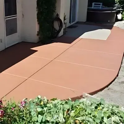 Coloured concrete patio and walkway for residential home in Birkenhead.