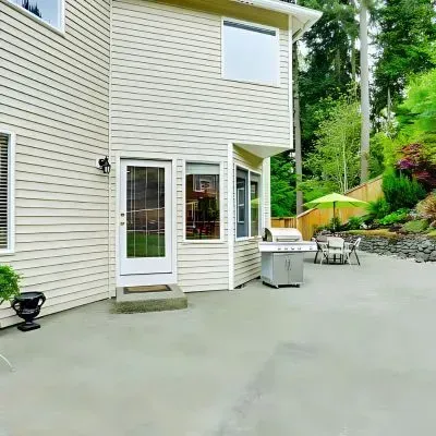 Concrete backyard and patio extension constructed by our contractors.