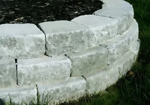 Concrete block garden retaining wall with bark for a tree in Fernhill.