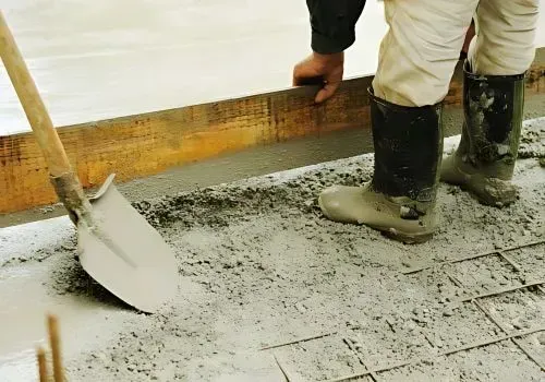 Concrete layers leveling freshly poured concrete in Hutt Central.