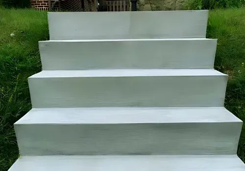Seven brand new concrete steps leading up to a residential customer's home in Normandale.