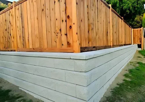 Concrete and timber retaining wall for residential privacy in Alicetown.