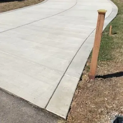 Cured concrete driveway with border finish in Melling.