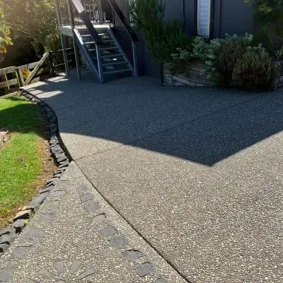 Exposed aggregate concrete backyard porch in Eastbourne, Lower Hutt, expertly crafted by our team.