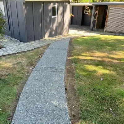 Rear view of exposed aggregate concrete footpath in Eastbourne, Lower Hutt, installed by our concrete experts.