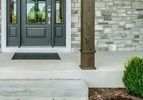 Front concrete porch with step leading to door, Stokes Valley, Lower Hutt.