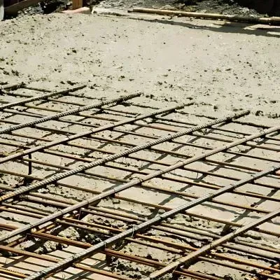 Grade 500E welded mesh reinforcement during concrete pour for large garage slab foundation in Stokes Valley, Lower Hutt.