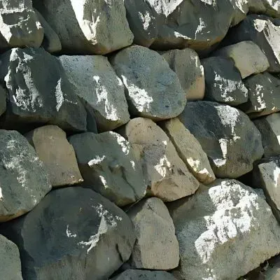 Contractors in Khandallah placed a natural stone retaining wall.