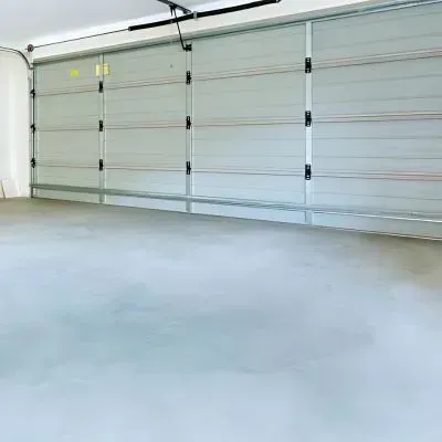 Newly poured concrete floor for an interior car garage for a customer in Stokes Valley.