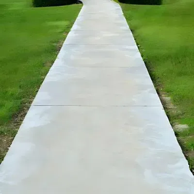 Plain concrete walkway with decorative swirl edges in Alicetown.
