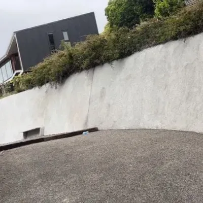 Sprayed (shotcrete) concrete retaining wall 20 metres long, 3 metres high. Installed in Normadale, Lower Hutt.