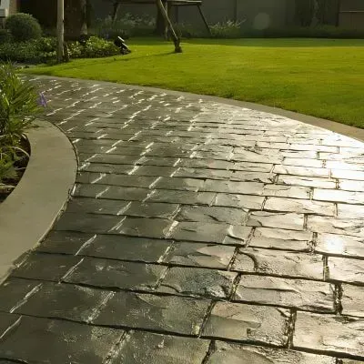 Curved stamped concrete walkway expertly placed in Petone Beach area, Lower Hutt.