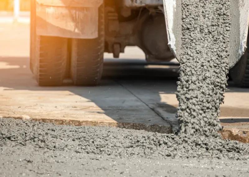 Concrete truck pouring wet concrete onto a construction site — All Concrete Creations in Kingscliff, NSW