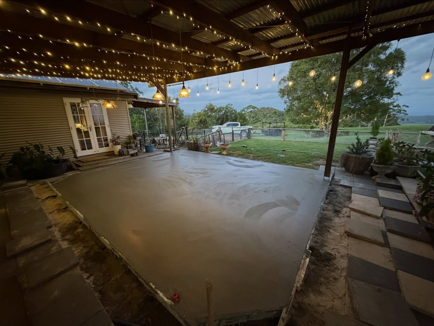 Newly Poured Concrete Patio Under a Corrugated Metal Roof — All Concrete Creations in Kingscliff, NSW