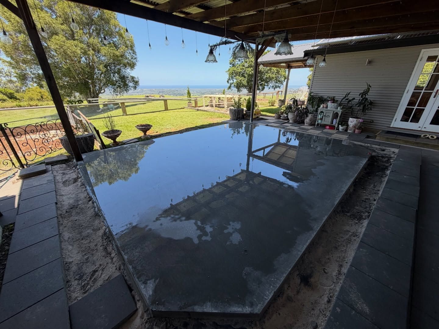 Newly Poured Concrete Patio Reflecting Sky and Surrounding Area — All Concrete Creations in Kingscliff, NSW