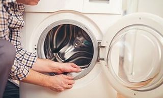Dishwasher — Technician Repairing a Washing Machine in Wooster, OH