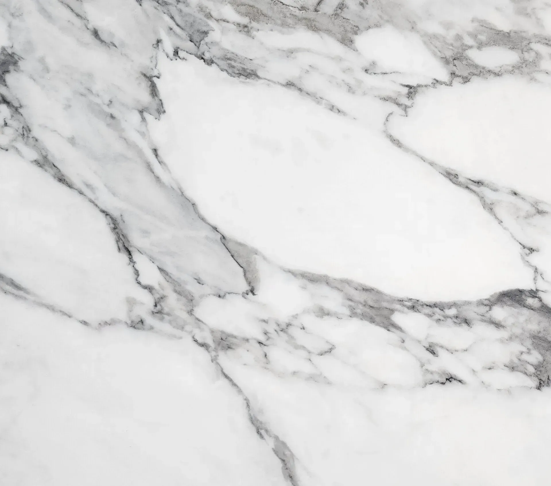 White marble surface with gray veining.