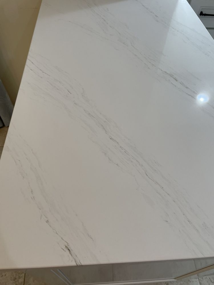 White countertop with gray veining.