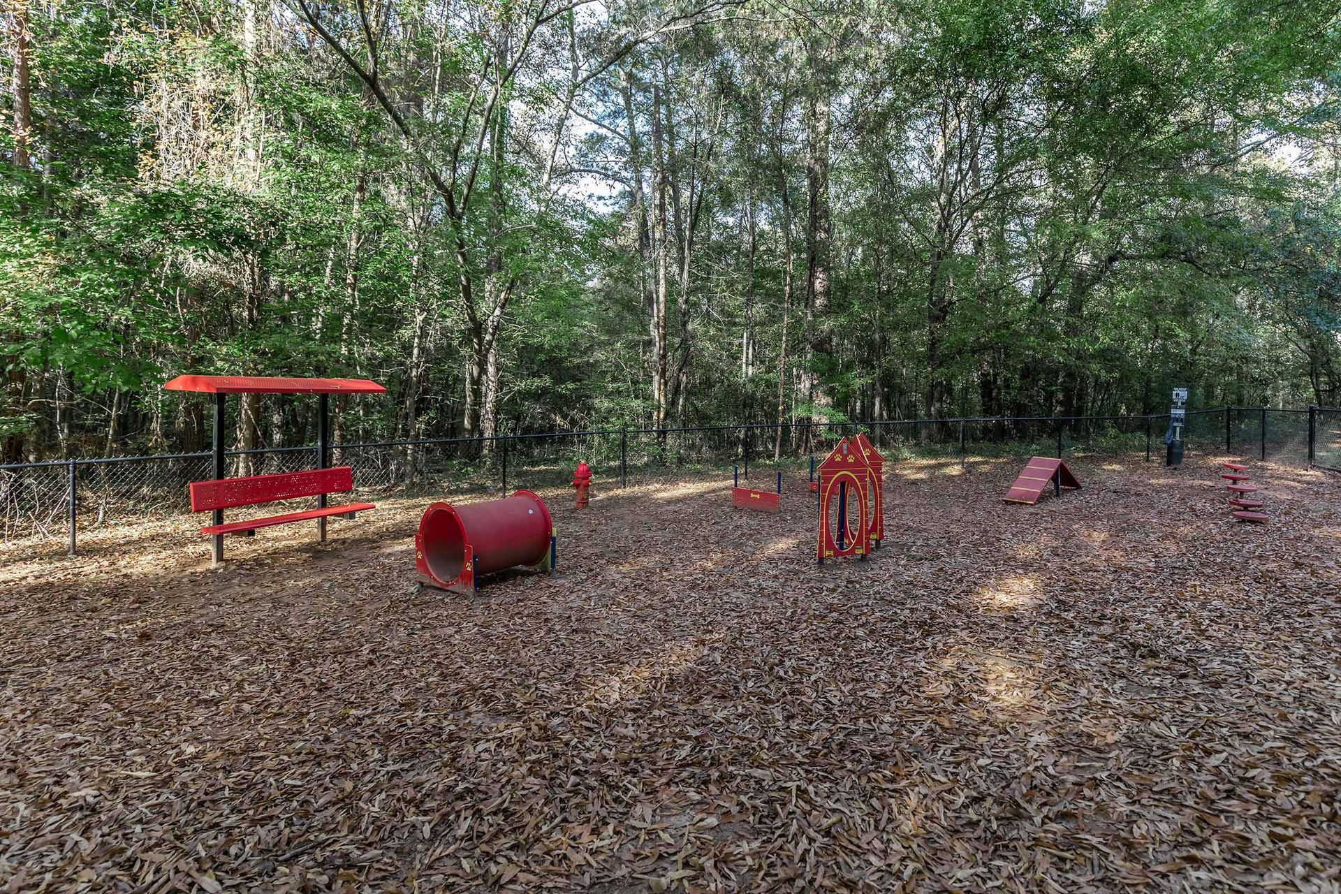 A dog park at Legacy at River Crossing Apartment Homes.