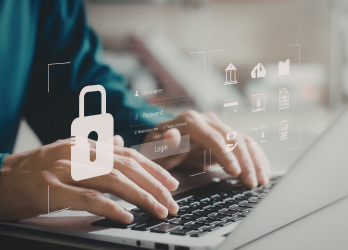 Hands typing on a laptop with a padlock icon overlay, suggesting online security and data protection.