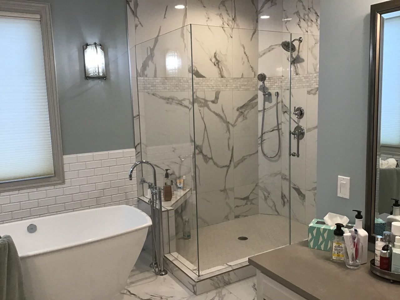 A Bathroom With A Walk In Shower And A Tub | Omaha, NE | DRD Home Services