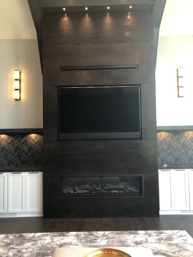 A Living Room With A Fireplace And A Flat Screen TV | Omaha, NE | DRD Home Services