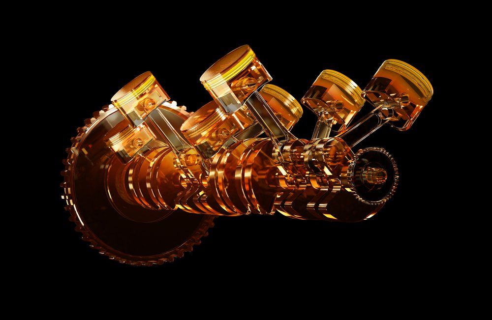 A group of pistons and a gear on a black background.