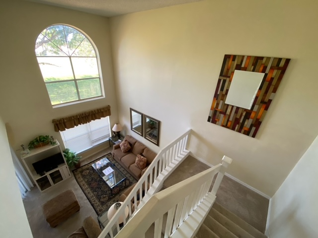 An aerial view of a living room from the second floor