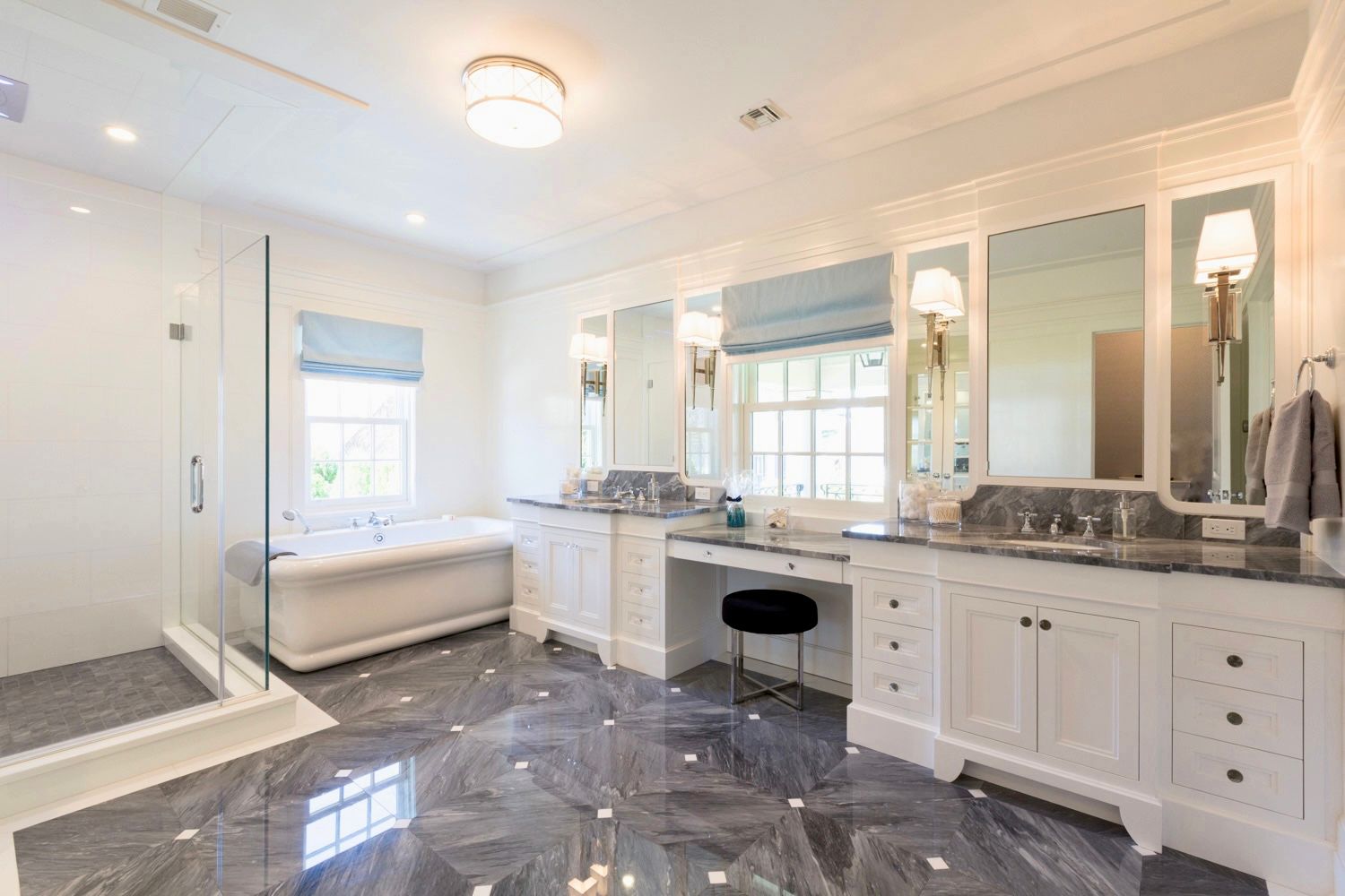 Luxurious white bathroom with marble floors