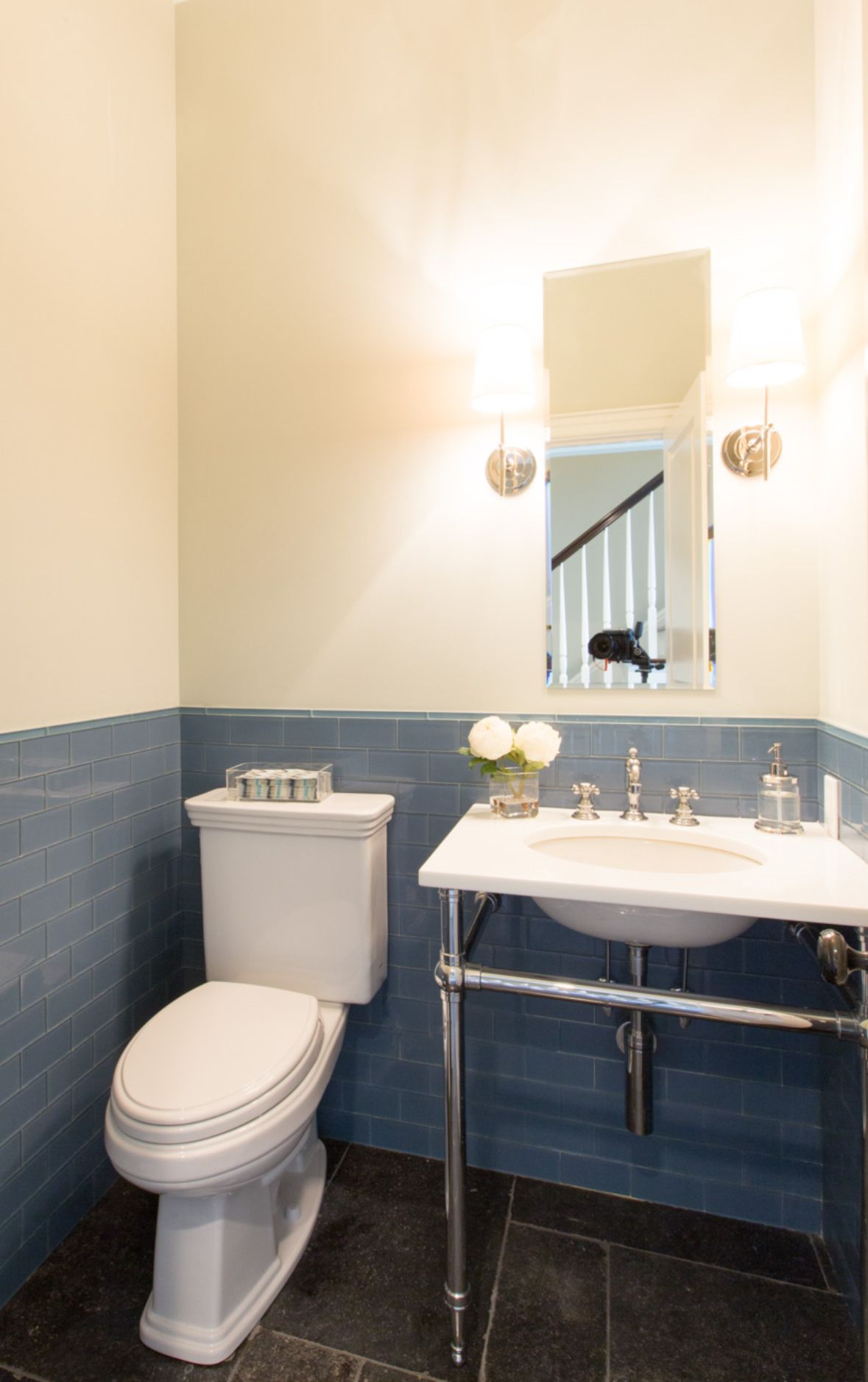 Small powder room with blue tiled walls