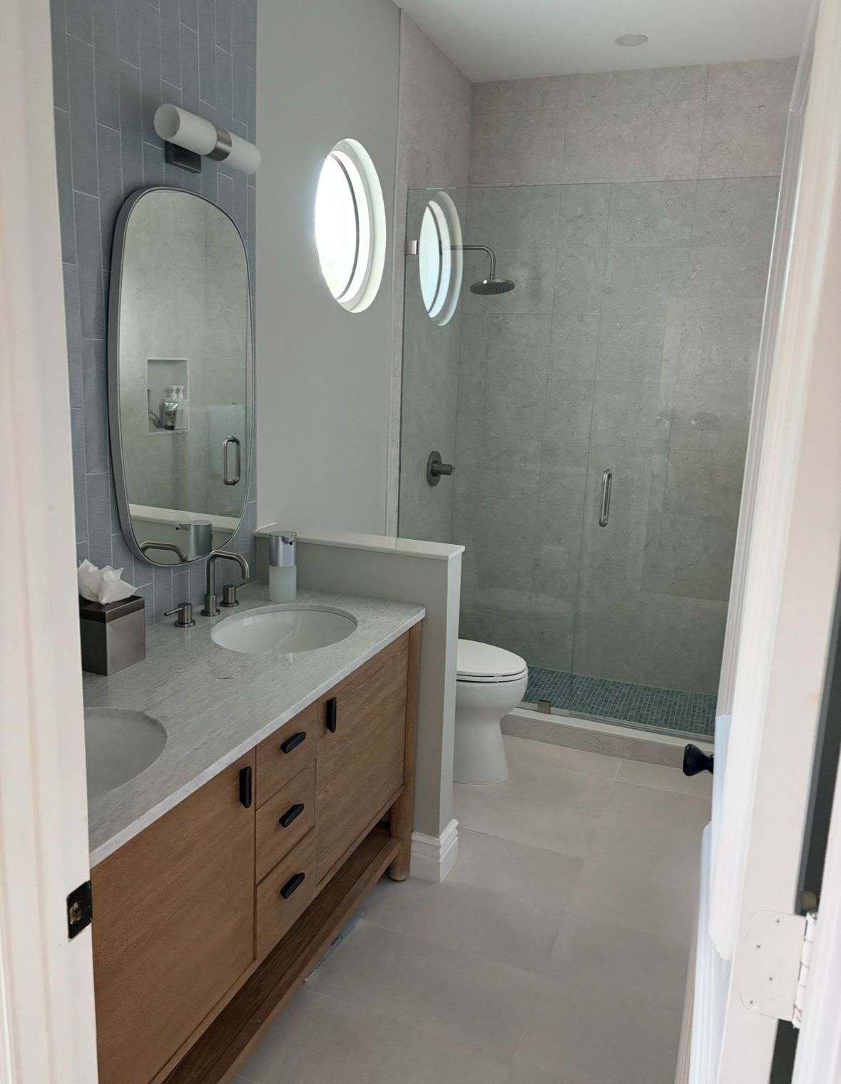 Modern bathroom with light wood vanity