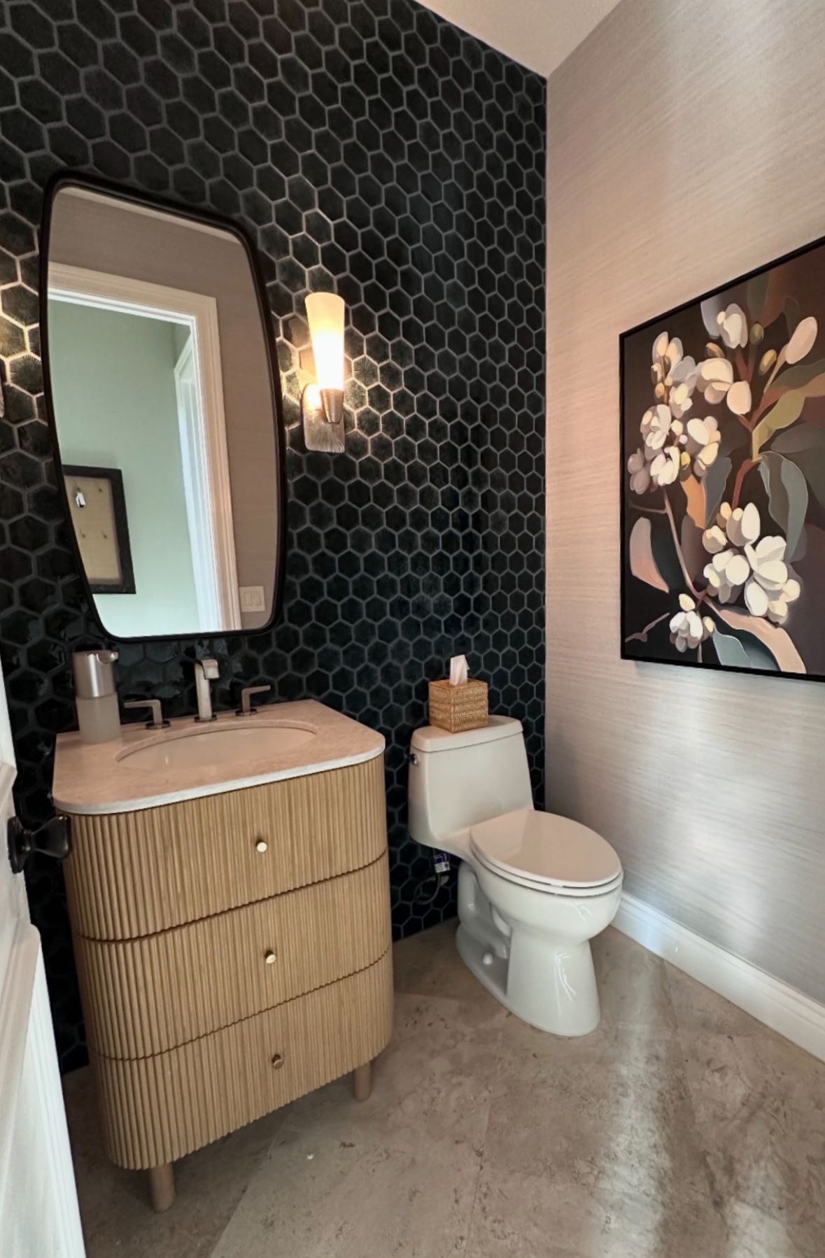 Bathroom with black hexagon tile wall
