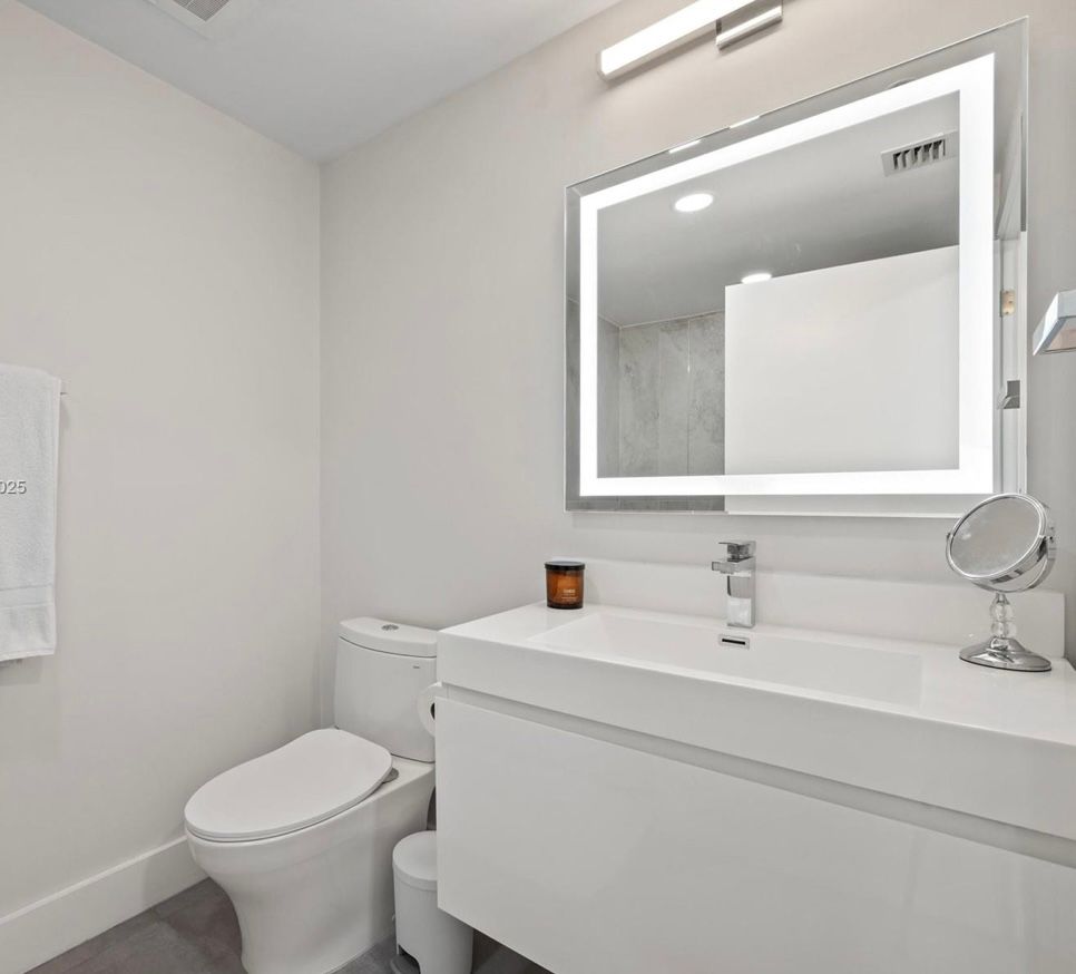 Modern white bathroom with toilet