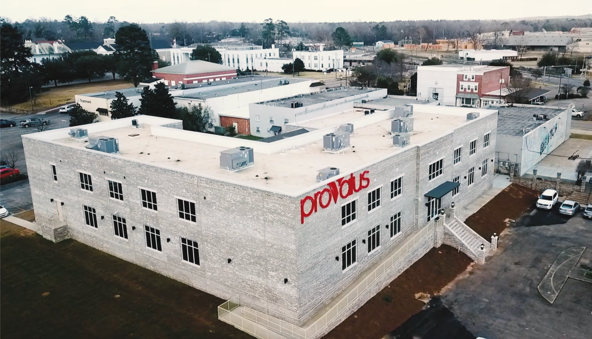 An aerial view of a large building that says pronius