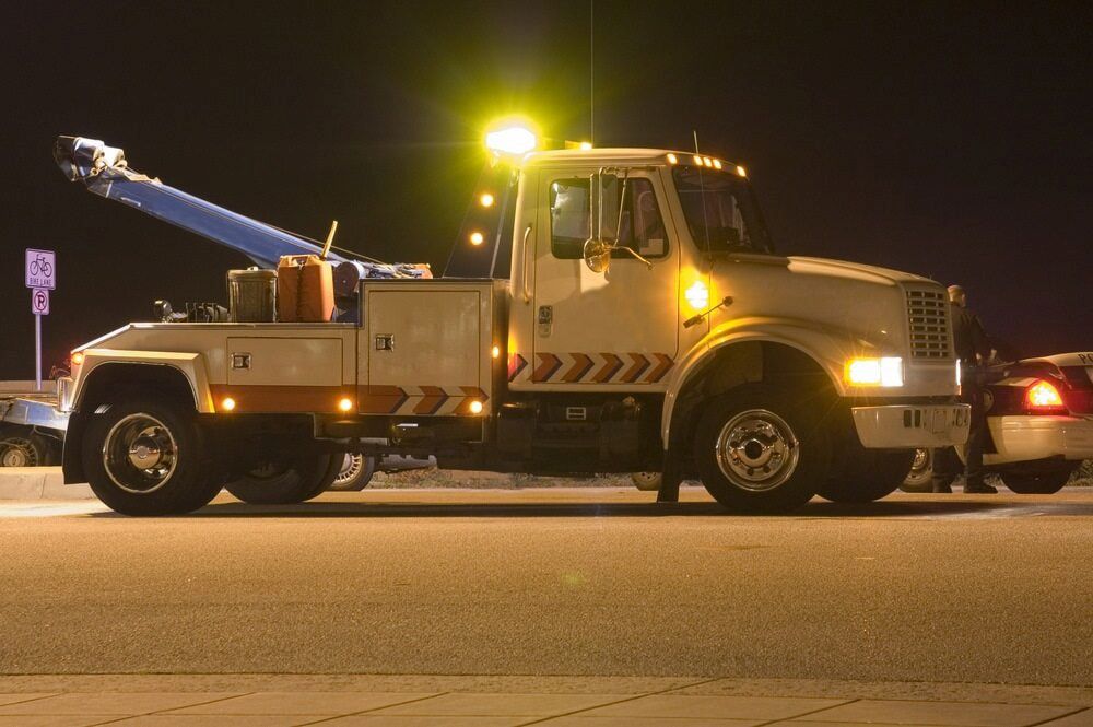 Tow Truck at Night With Its Lights on — Aura Towing Service in Rainbow Beach, QLD