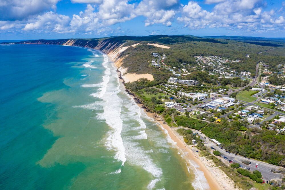Turquoise Ocean Meets Sandy Beach — Aura Towing Service in Rainbow Beach, QLD