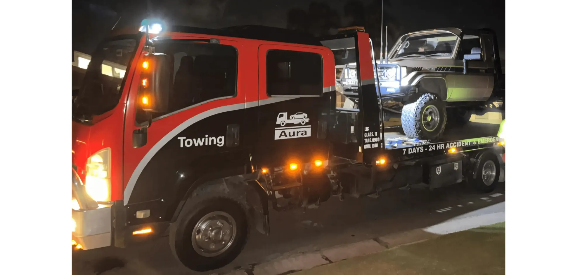 A Car is Being Towed by a Tow Truck — Aura Towing Service in Baringa, QLD
