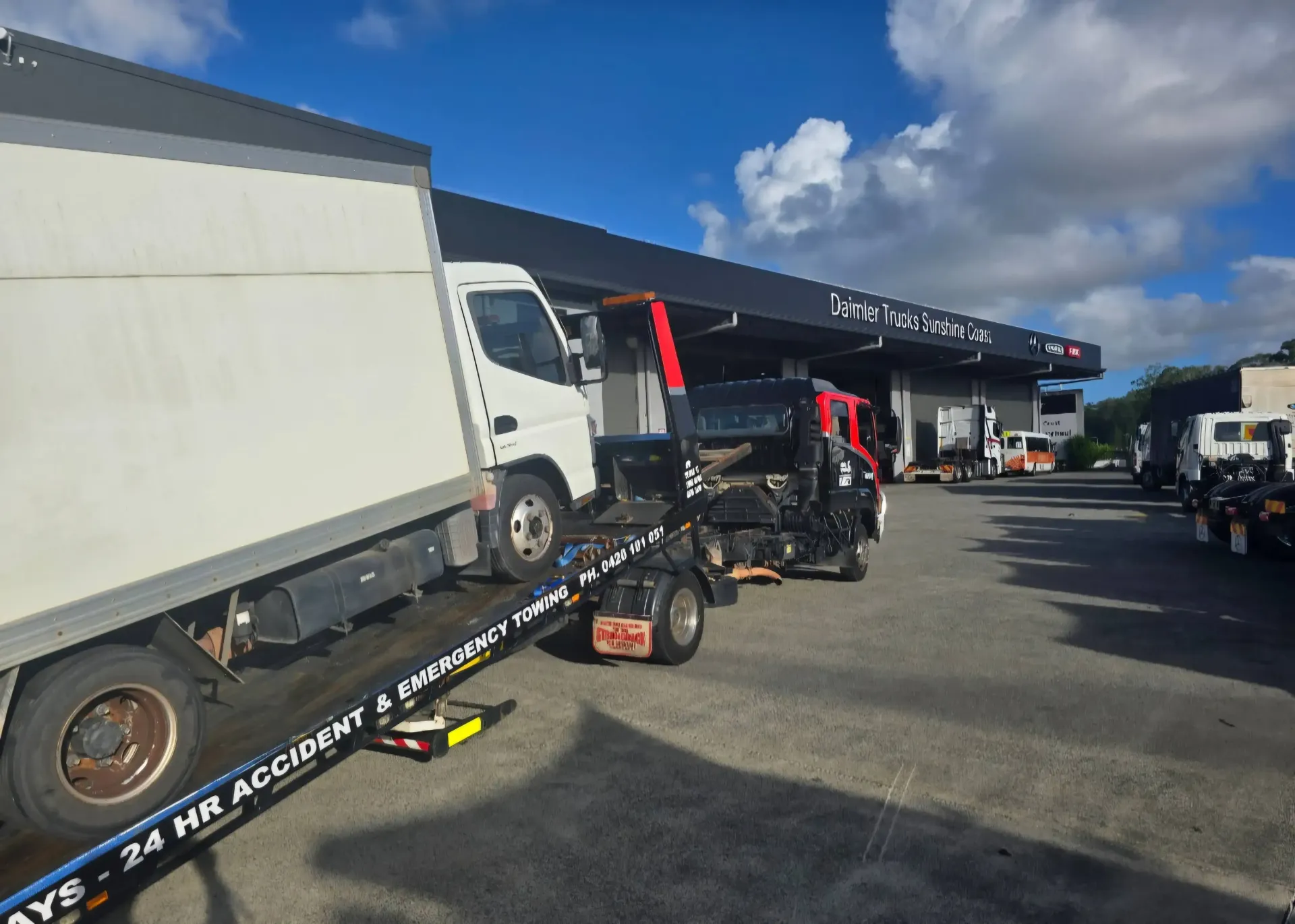 A Car is Being Towed on the Roadside — Aura Towing Service in Baringa, QLD