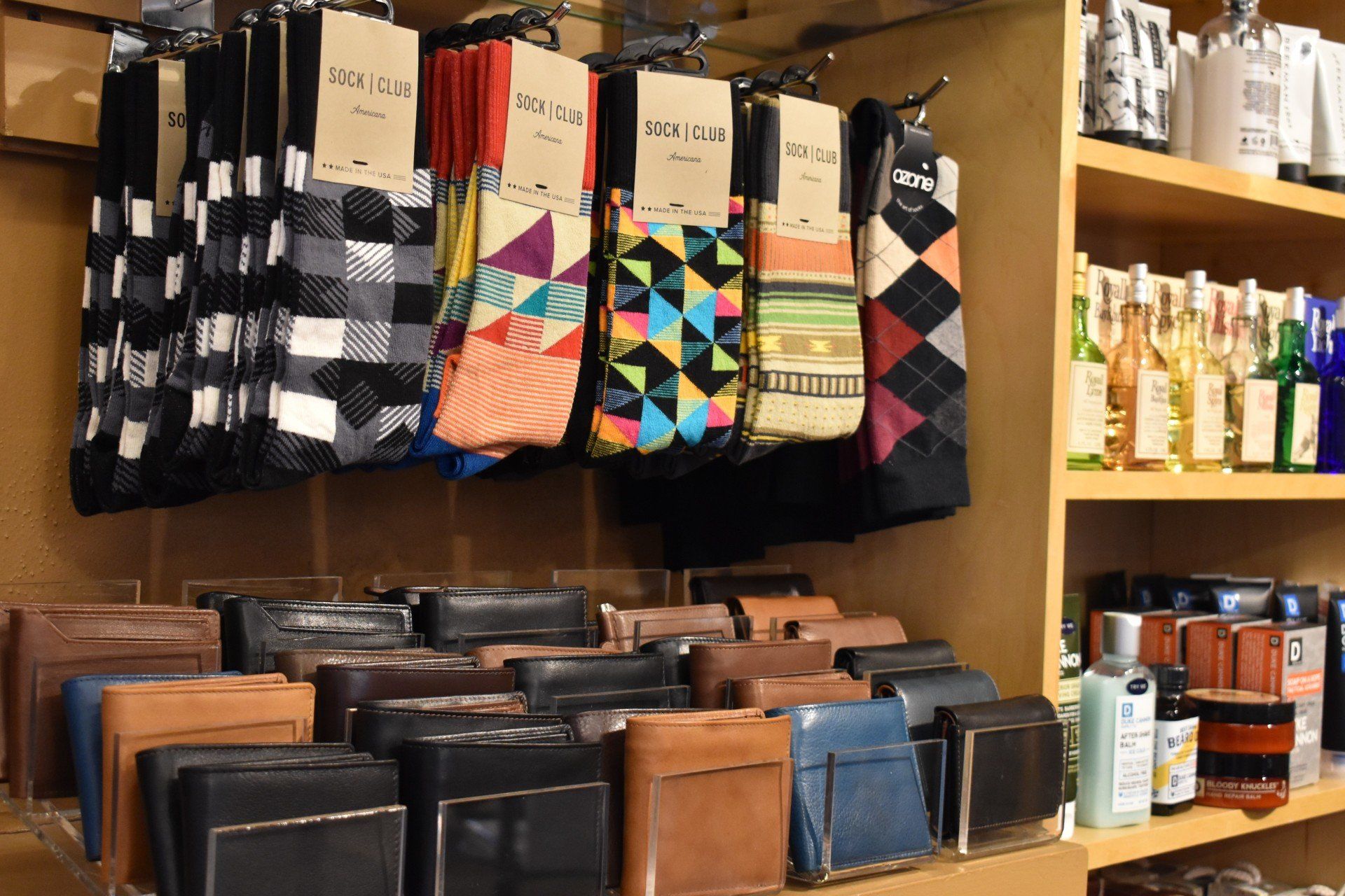 A display of socks and wallets in a store.