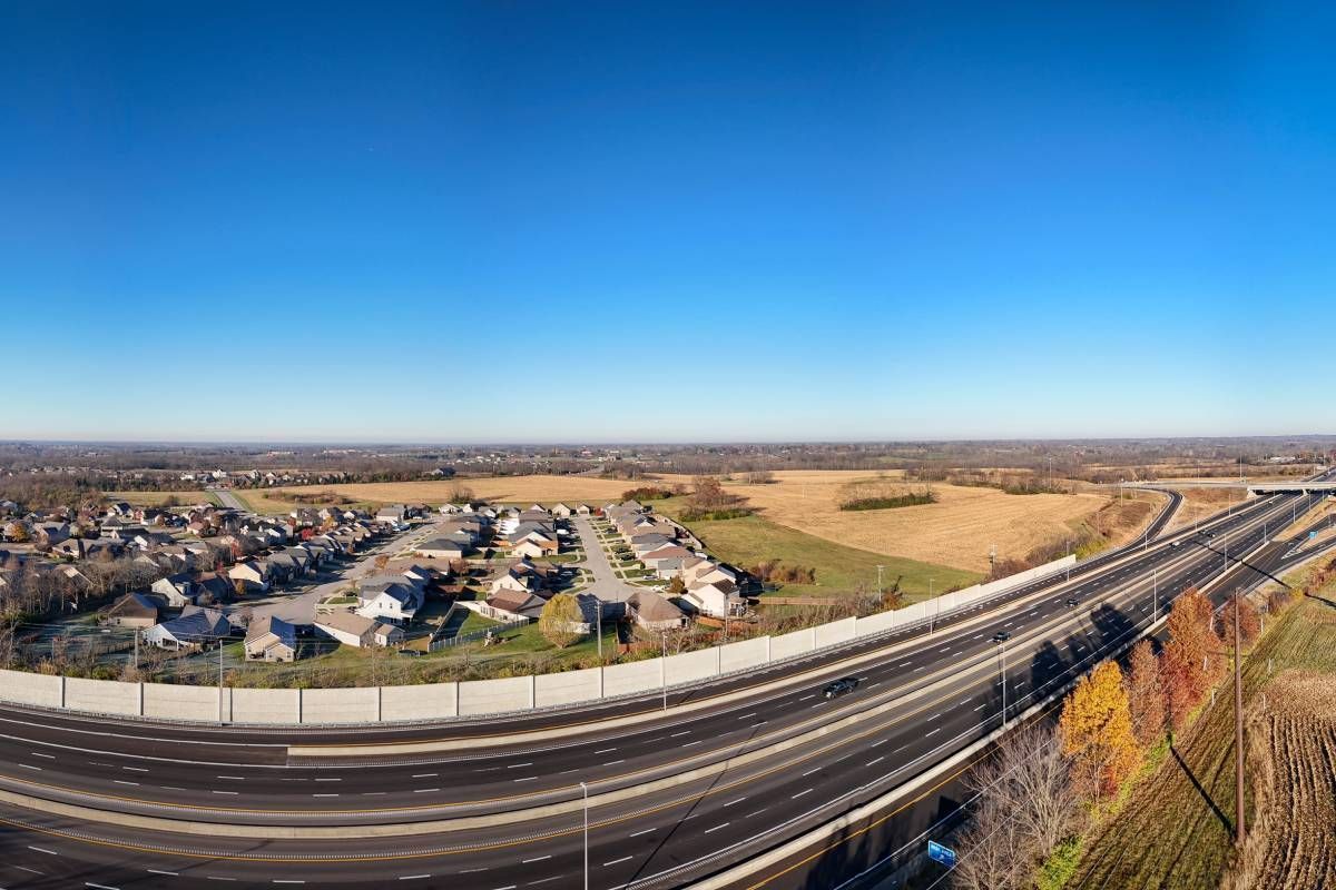 Landscape image of rural Georgetown, Kentucky, featuring a highway and cars near Lexington, KY