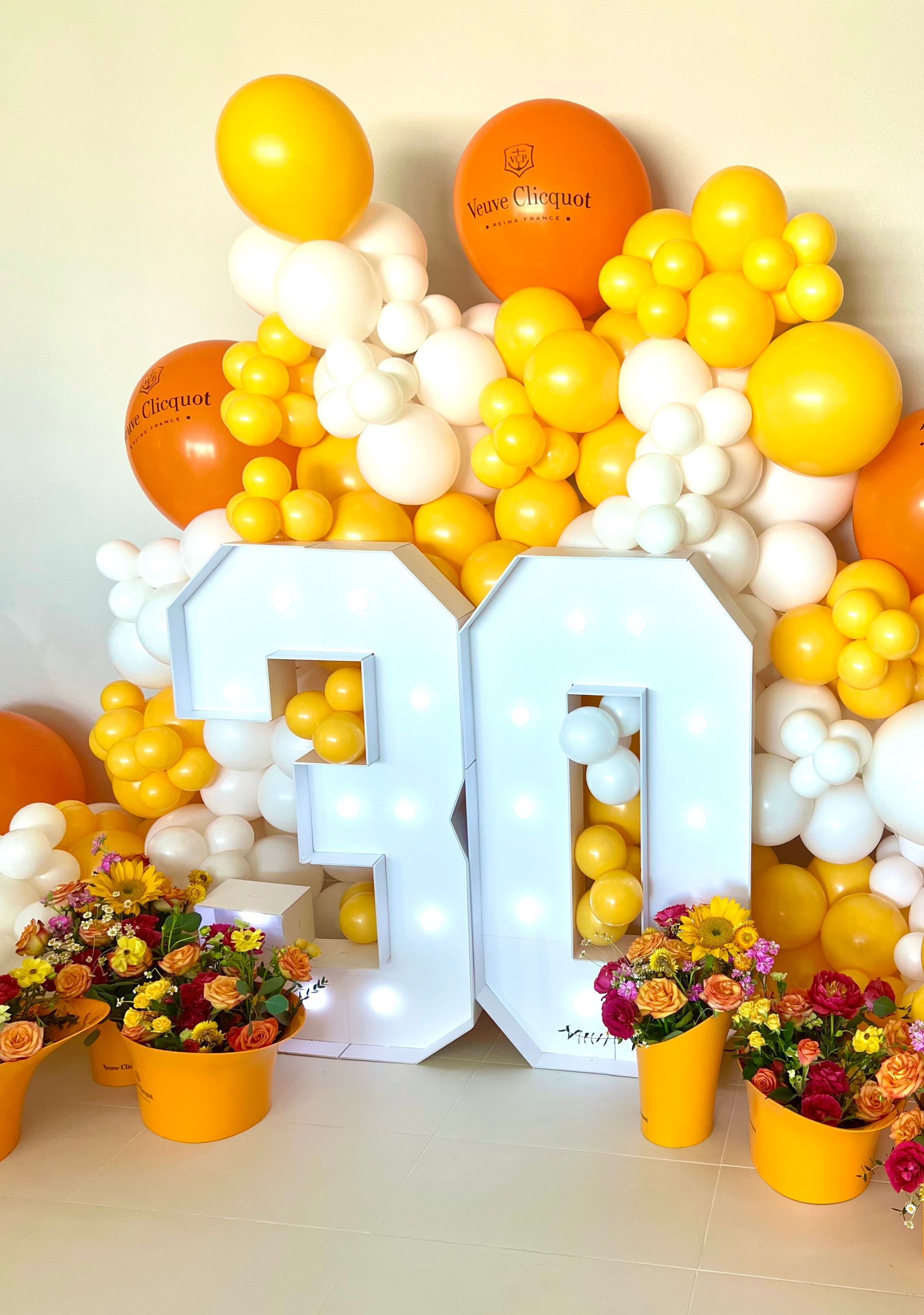 Veuve Clicquot 30th theme birthday party with flowers and balloons